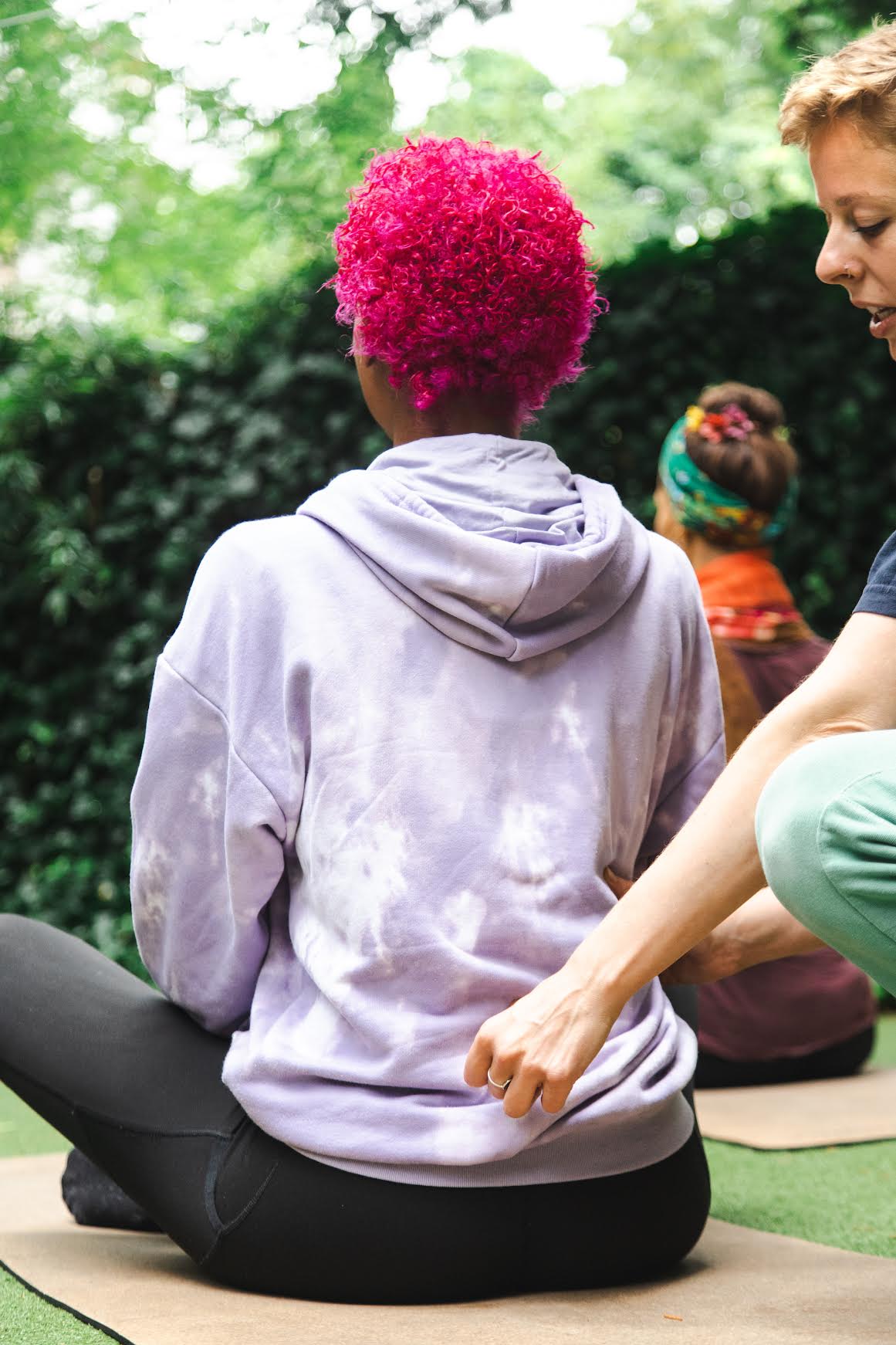 Trainer supporting client with strength training